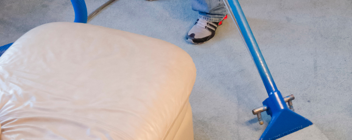 Windell's Carpet Care owner Aaron Windell uses the best carpet cleaning method, hot water extraction, to clean a gray carpet. An eco-friendly way to clean and remove odor from carpets.